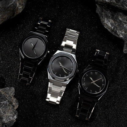 Three watches with black faces and metal bands on a dark textured surface.