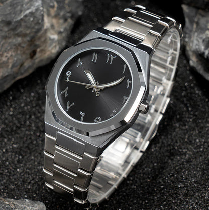 Silver watch with black face on a dark textured background