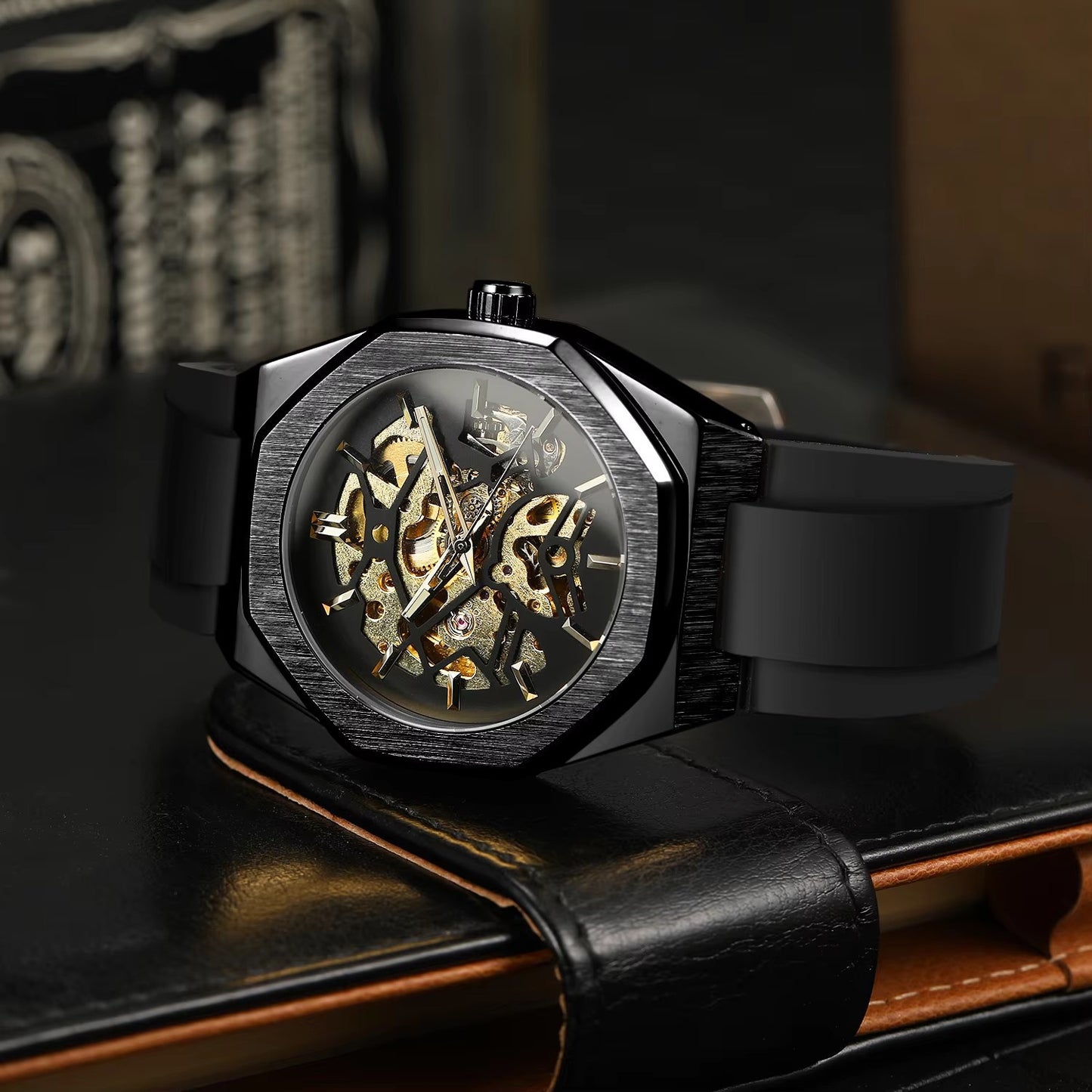 Black wristwatch with a detailed mechanical face on a dark surface