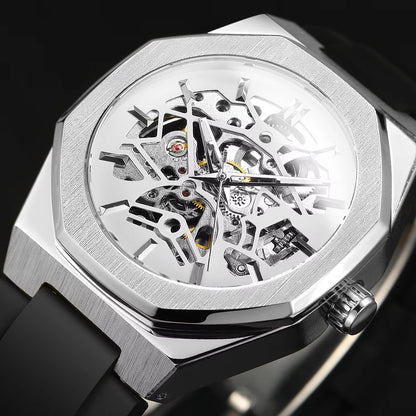 Silver skeletonized watch with black strap on a dark background