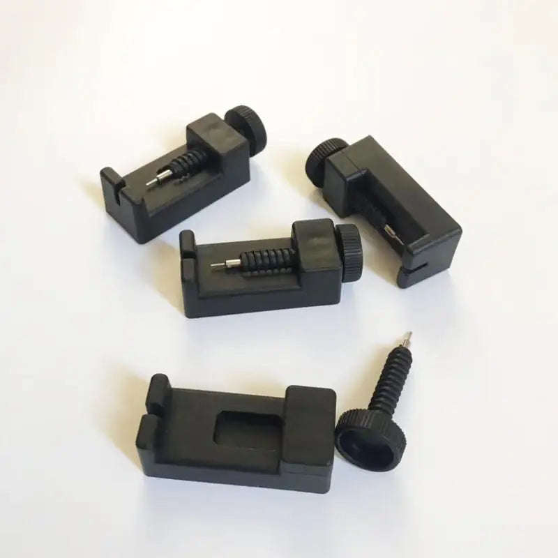 Set of black mechanical components on a white background